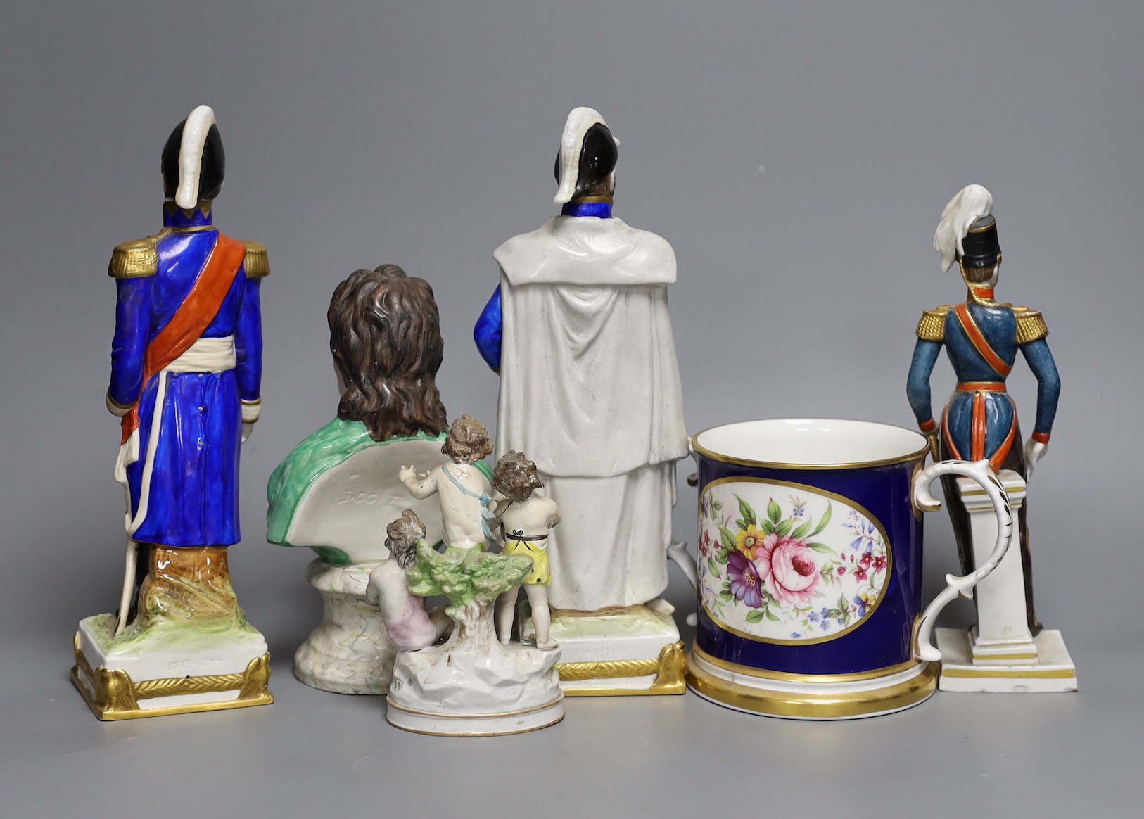 A Staffordshire bust inscribed Locke and three military figures, a two handled tankard and a cherub group, bust 19cms high